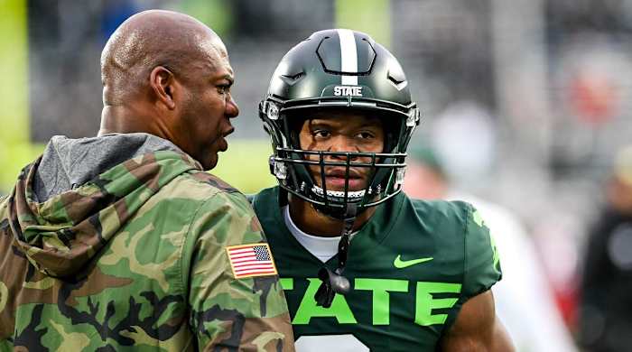 Michigan State head coach Mel Tucker, left, gets Kenneth Walker III fired up before the game against Maryland on Saturday, Nov. 13, 2021, at Spartan Stadium in East Lansing.